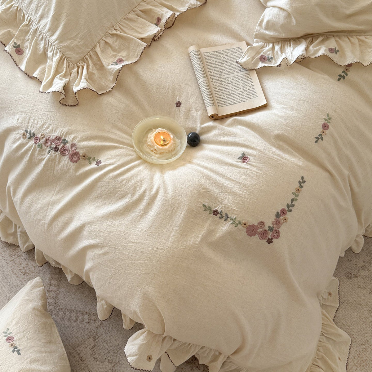 Bedding set in natural linen style with delicate rose garland embroidery and ruffled trim — product view 1