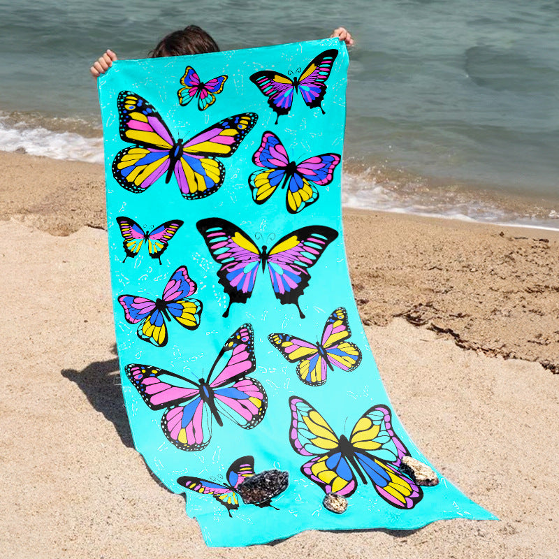 Beach towel with vibrant, colorful animal motif LoungeYard — product view 1