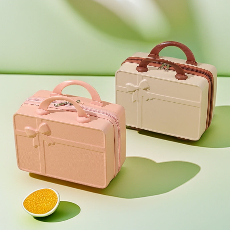structured hard-shell cosmetic travel case with embossed bow and dual top handles LoungeYard — product view 1