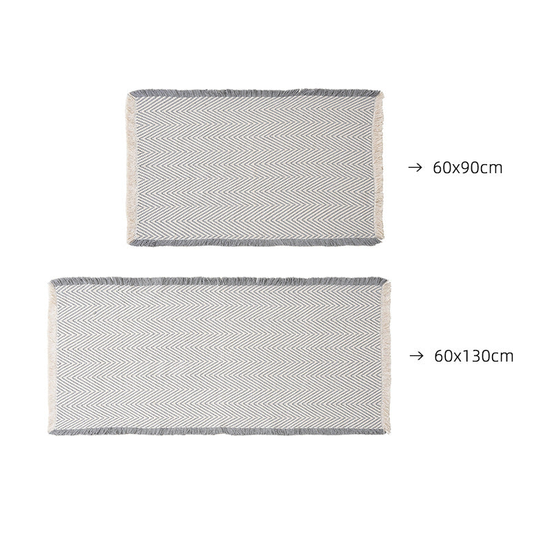 Handwoven cotton bath mat with herringbone pattern and fringes LoungeYard — product view 6
