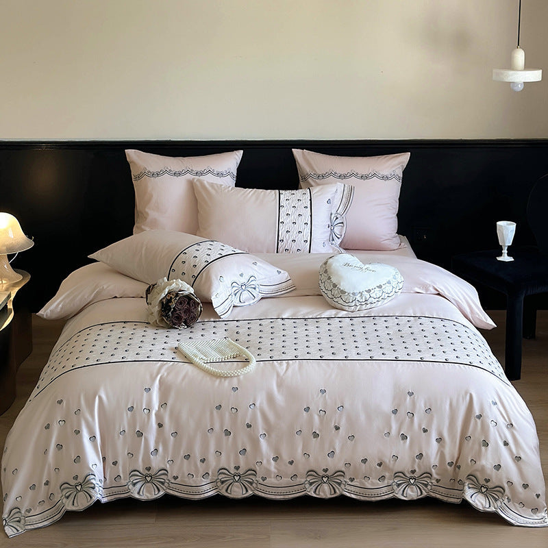 Romantic cotton satin bedding set with embroidered ribbon borders and decorative pillow — product view 7