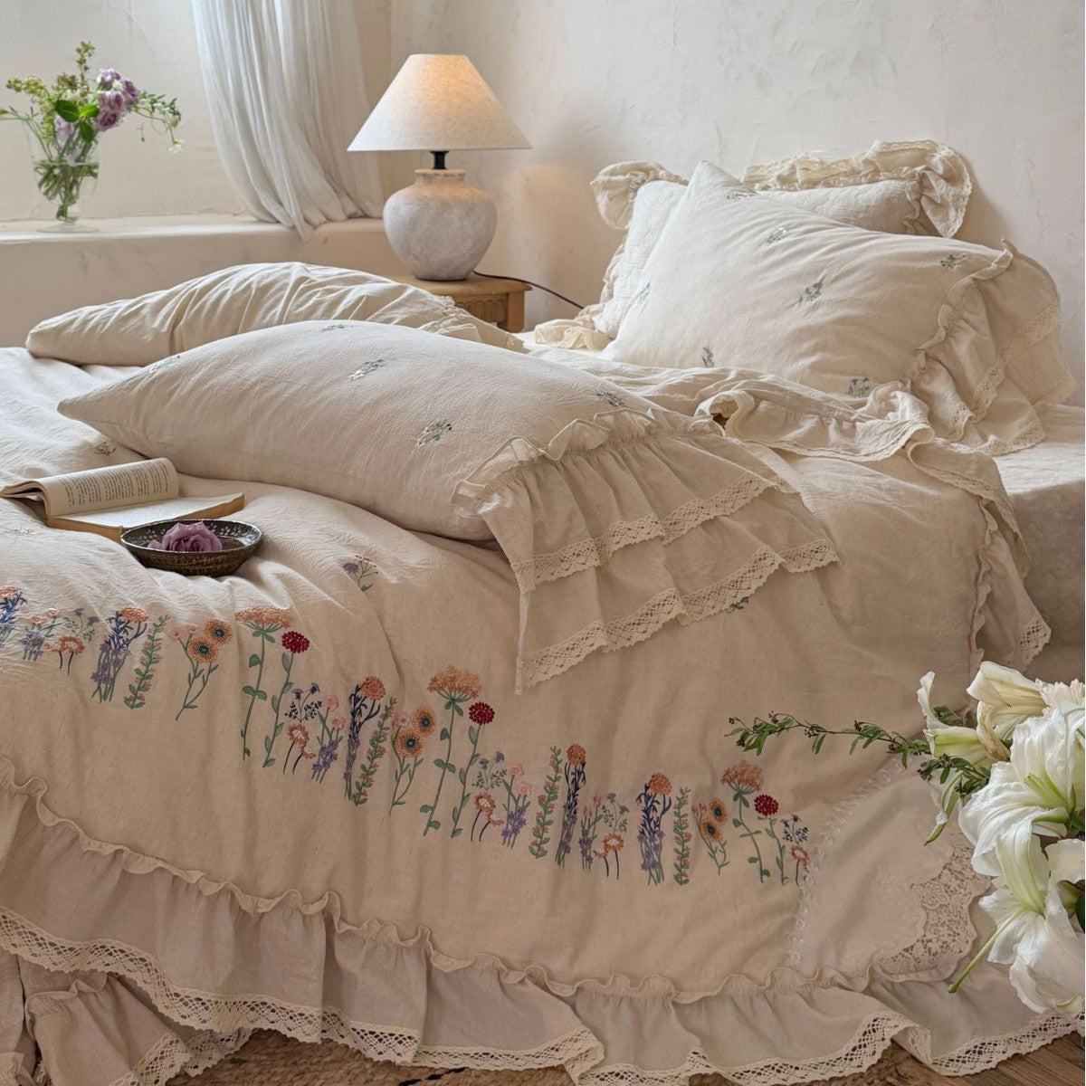 Romantic linen-cotton bedding set with embroidered floral border and ruffle — product view 1