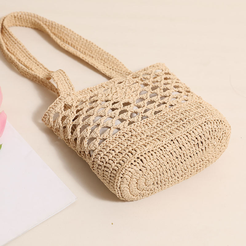 Handcrafted net straw bag with elegant straps LoungeYard — product view 2