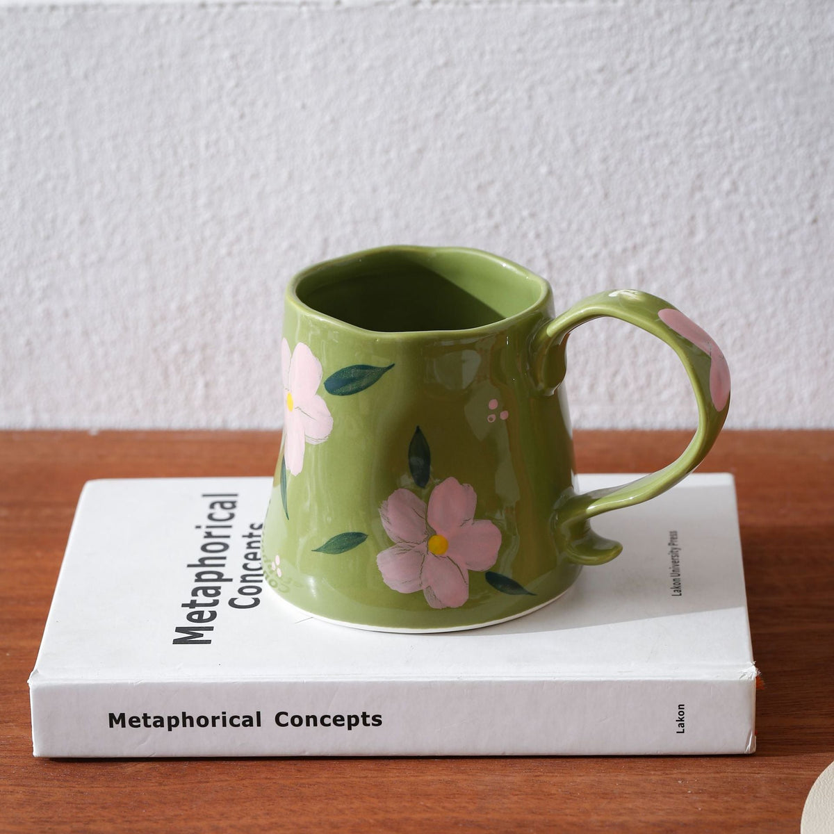 Hand-shaped ceramic mug with cloud relief and organic edge — product view 6