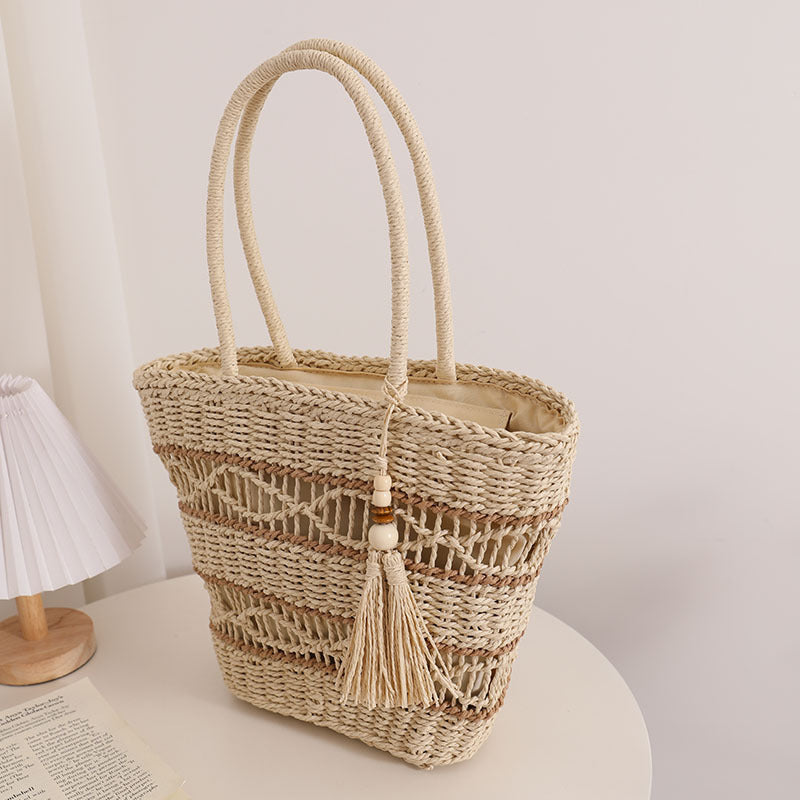 Handcrafted straw tote bag with decorative tassel detail LoungeYard — product view 4