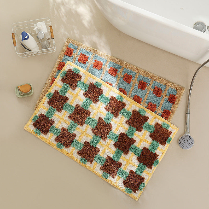Hand-tufted bathroom bath mat with non-slip backing and textured square relief LoungeYard — product view 2
