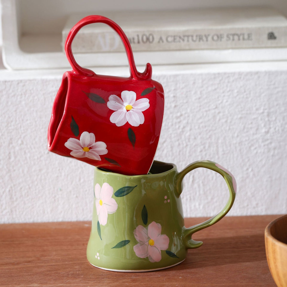 Hand-shaped ceramic mug with cloud relief and organic edge — product view 1