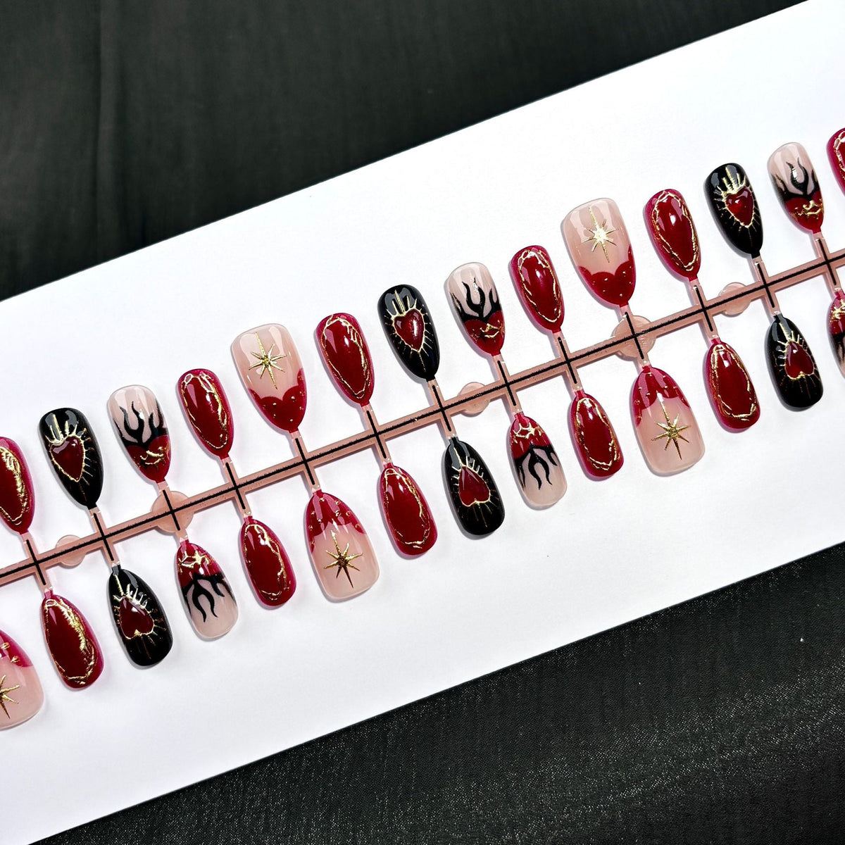 Artistic Press-On Nail Set with Heart and Flame Designs — product view 2