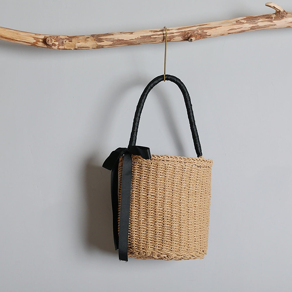 Handwoven basket bag with decorative fabric ribbon LoungeYard — product view 1