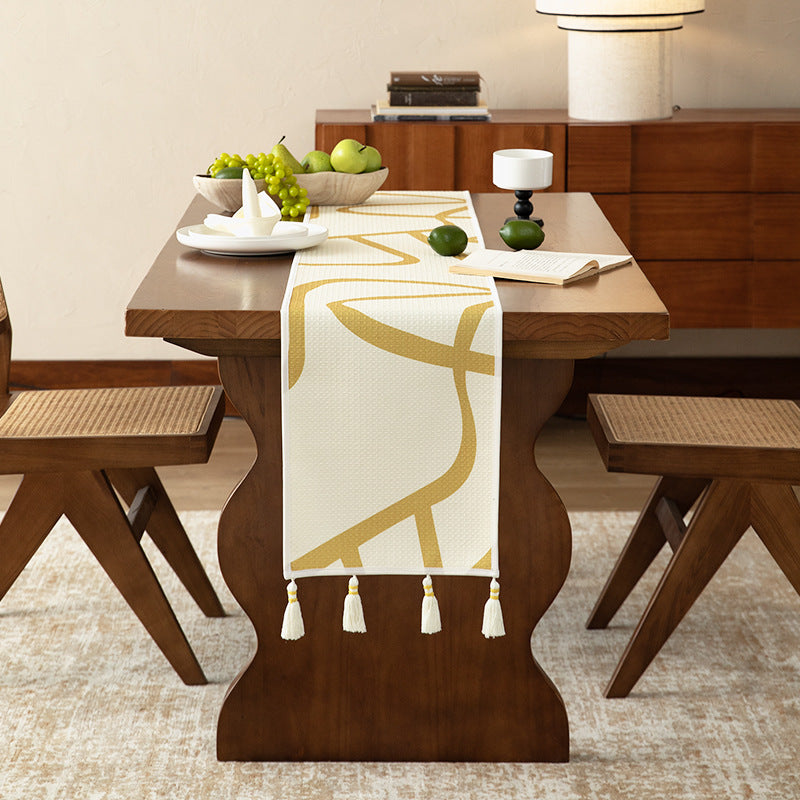 Light waffle texture throw blanket with geometric print and tassels — product view 3