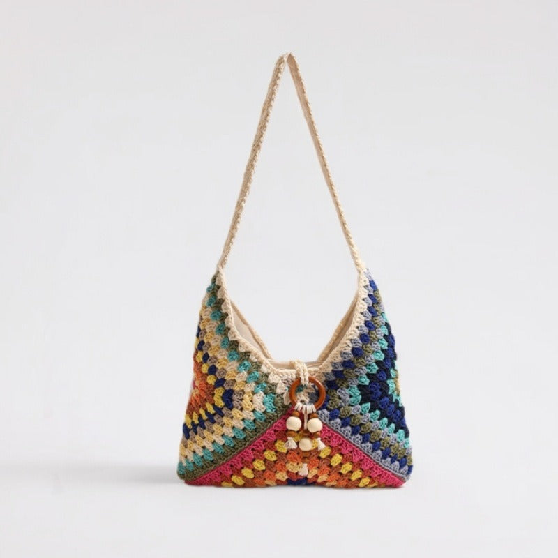 Handmade macrame shoulder bag with playful pendant LoungeYard — product view 1