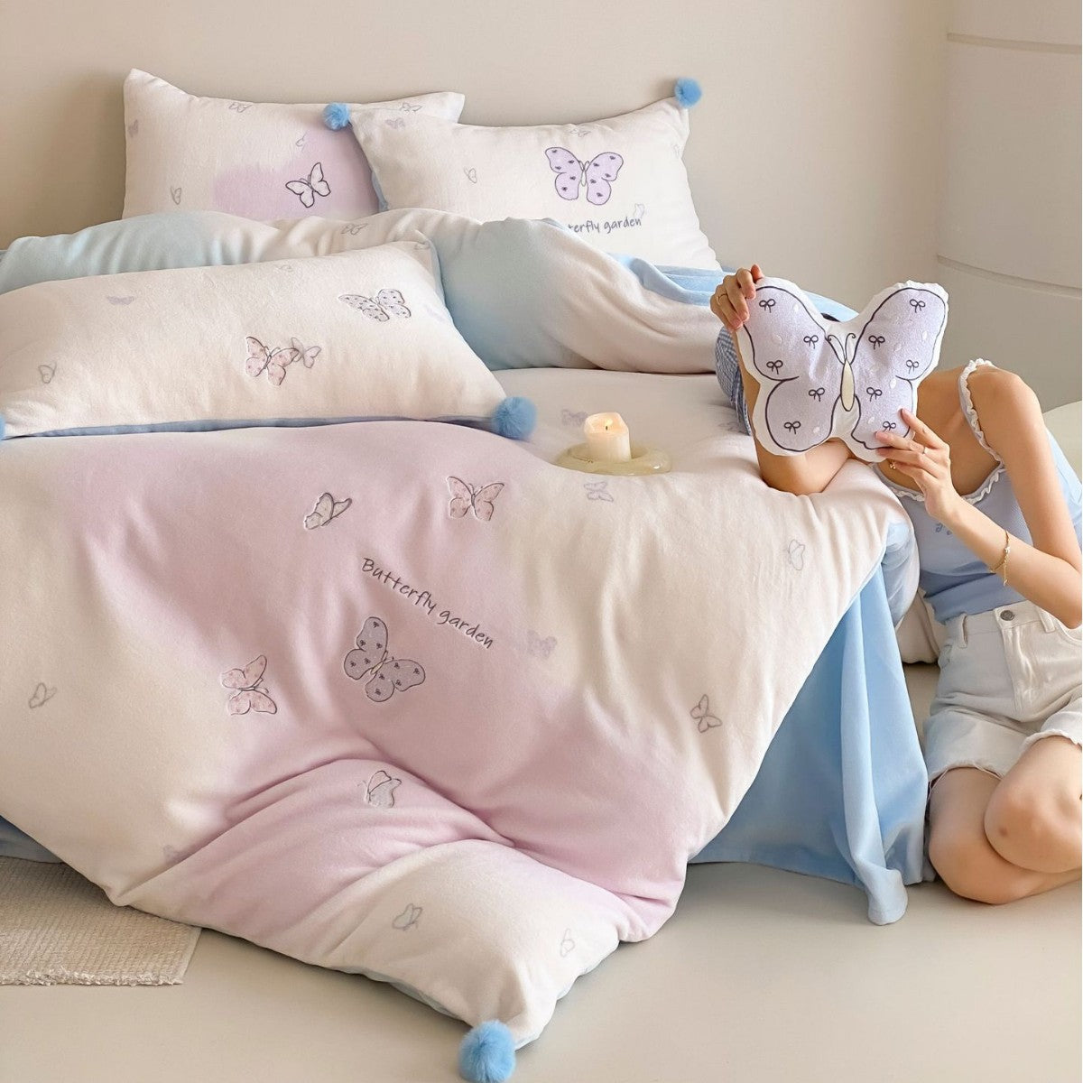 Children's bedding set with butterfly embroidery and pom pom details LoungeYard — product view 1