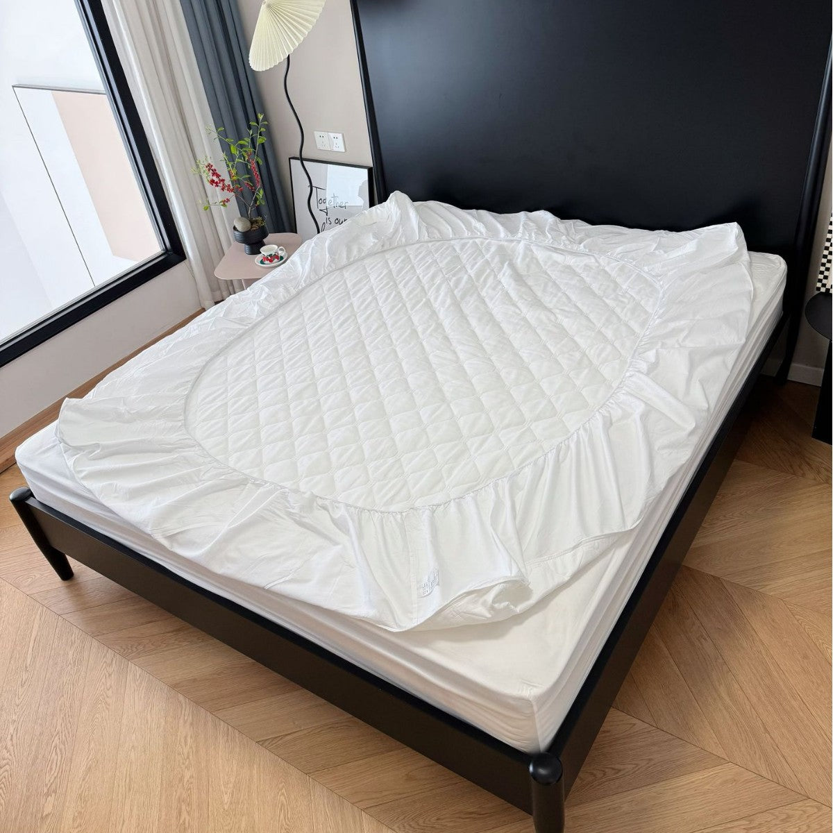Quilted mattress protector with all-round elastic and non-slip underside — product view 1