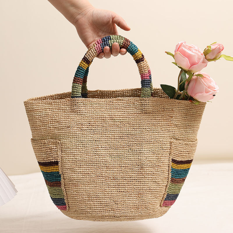 Handcrafted basket bag with colorful stripe accents LoungeYard — product view 1