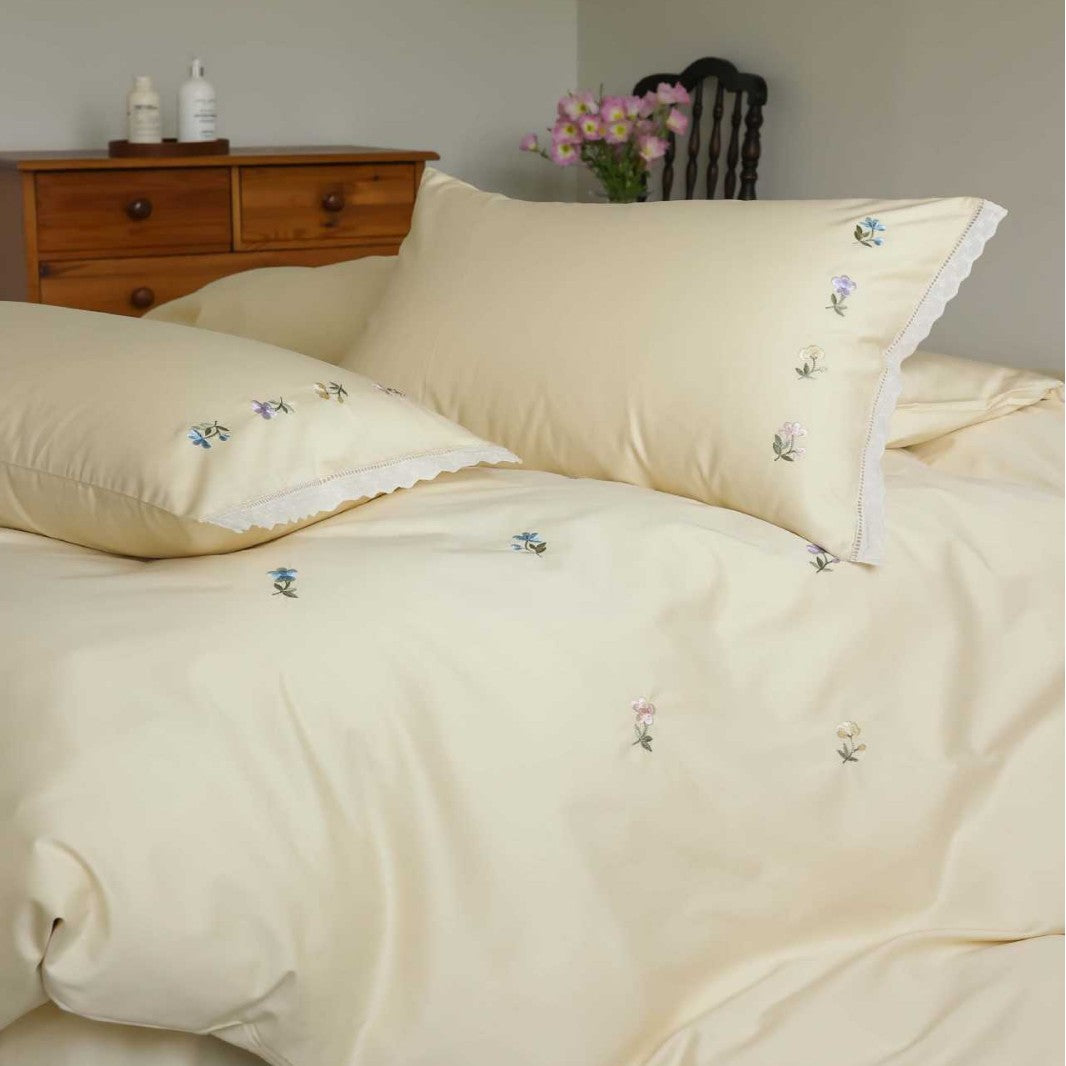 Embroidered cotton satin bedding set with subtle floral scatter design — product view 1
