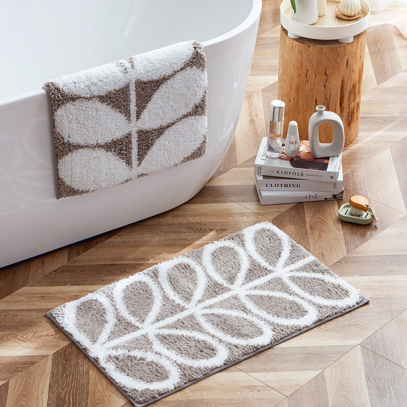 Fluffy bath mat in a graphic wave relief with anti-slip base LoungeYard — product view 2