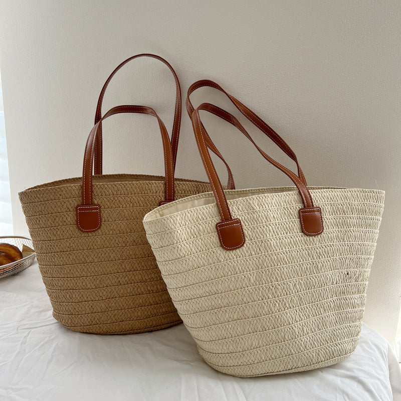 Handcrafted straw bag with elegant leather handles LoungeYard — product view 1