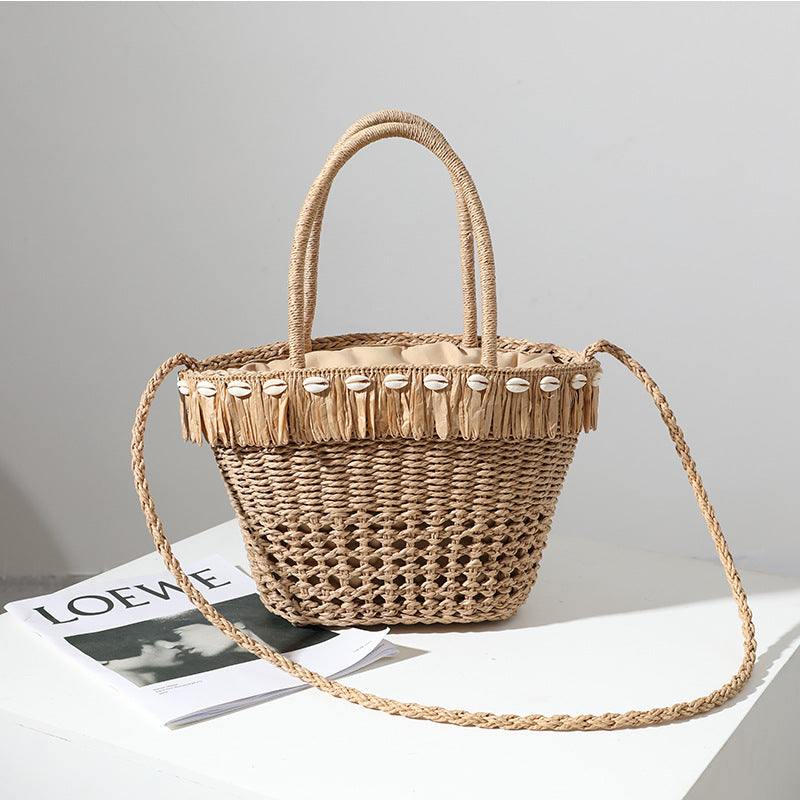 Braided straw bag with decorative tassel detail LoungeYard — product view 1
