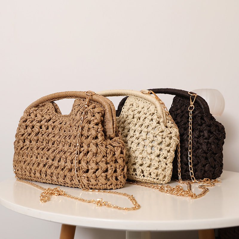 Handcrafted rattan bag with elegant handles and chain straps LoungeYard — product view 1