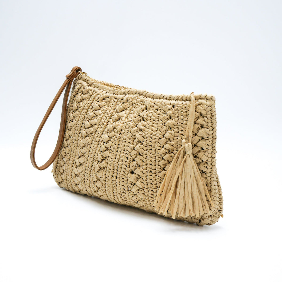 Woven natural material handbag with tassel LoungeYard — product view 2