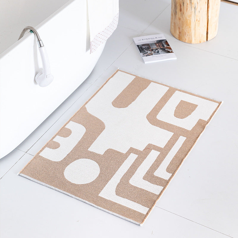 Flat-woven bath mat with abstract geometric pattern LoungeYard — product view 1