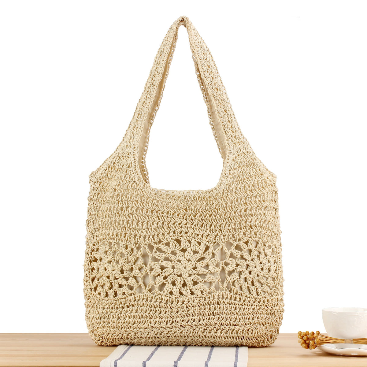 Versatile straw shoulder bag with floral details LoungeYard — product view 1