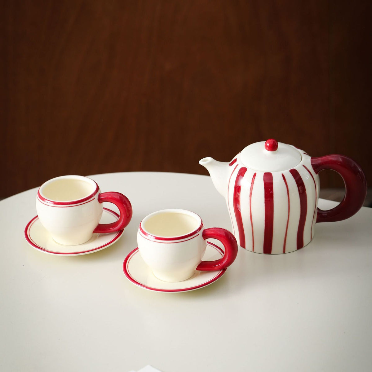 Porcelain tea set with vertical stripe decor and ergonomic handles — product view 5