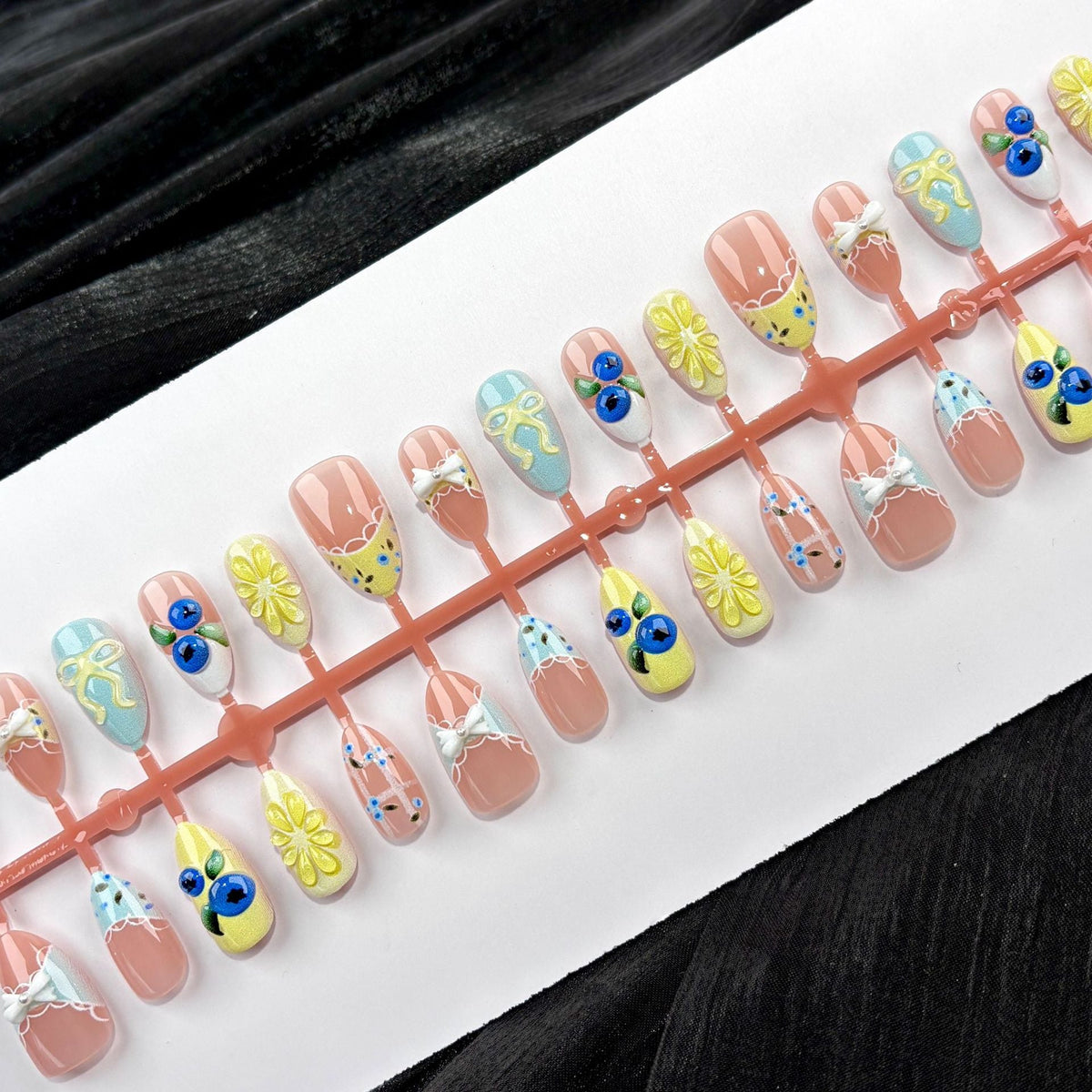 Decorative Press-On Nail Art Set with Floral and Bow Accents — product view 2