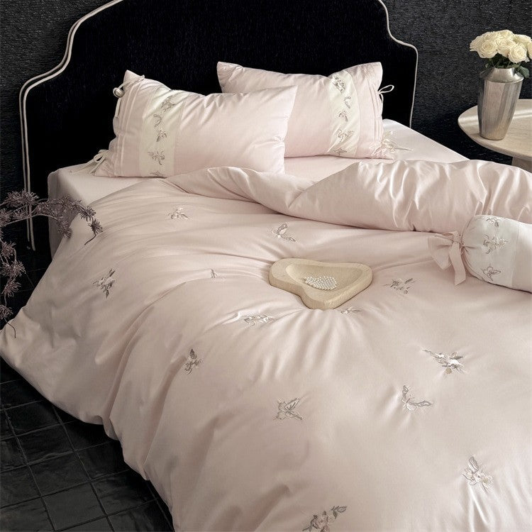 Luxurious satin bedding set with embroidered floral appliqués and bolster LoungeYard — product view 2