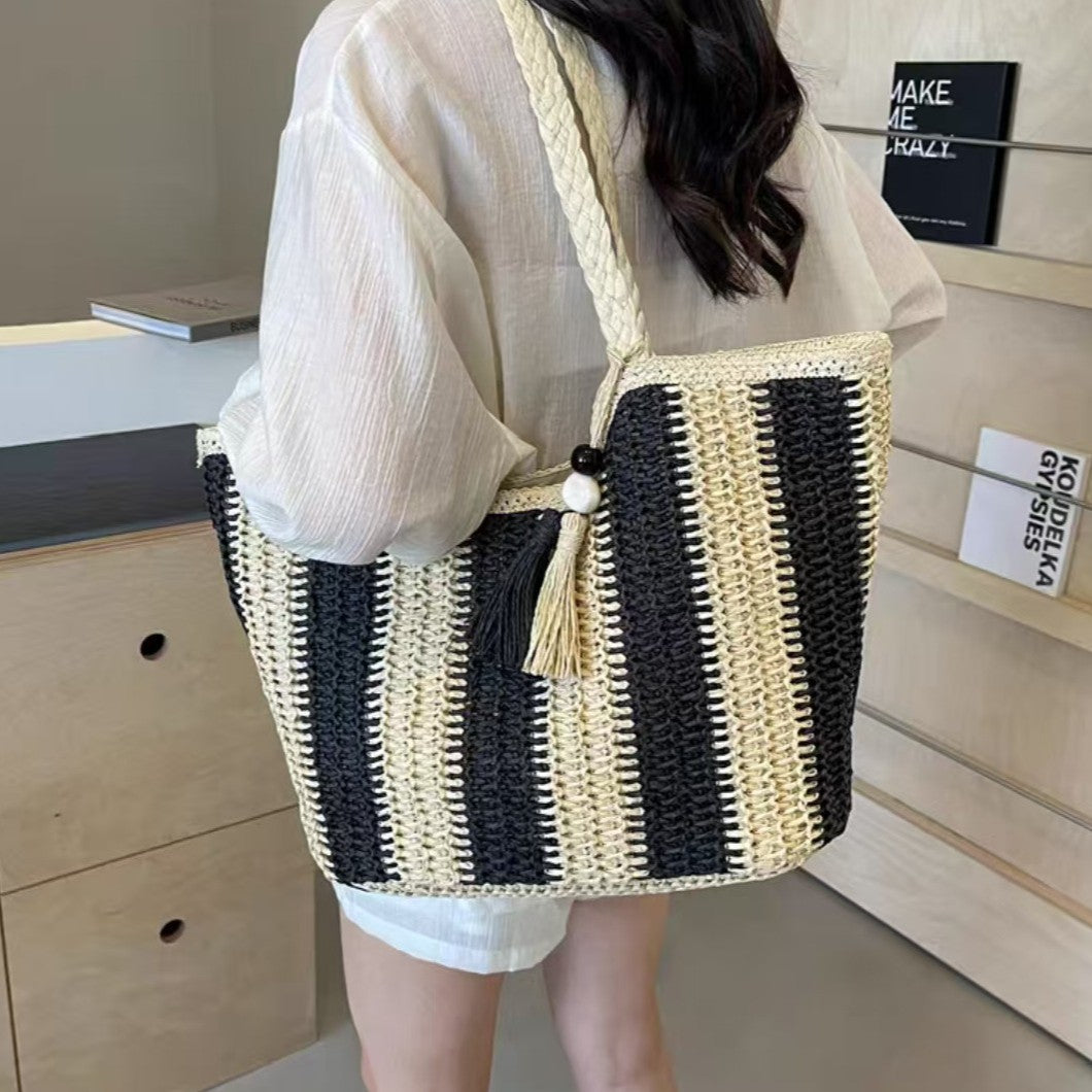 Beach bag with cheerful stripes and tassel details LoungeYard — product view 1