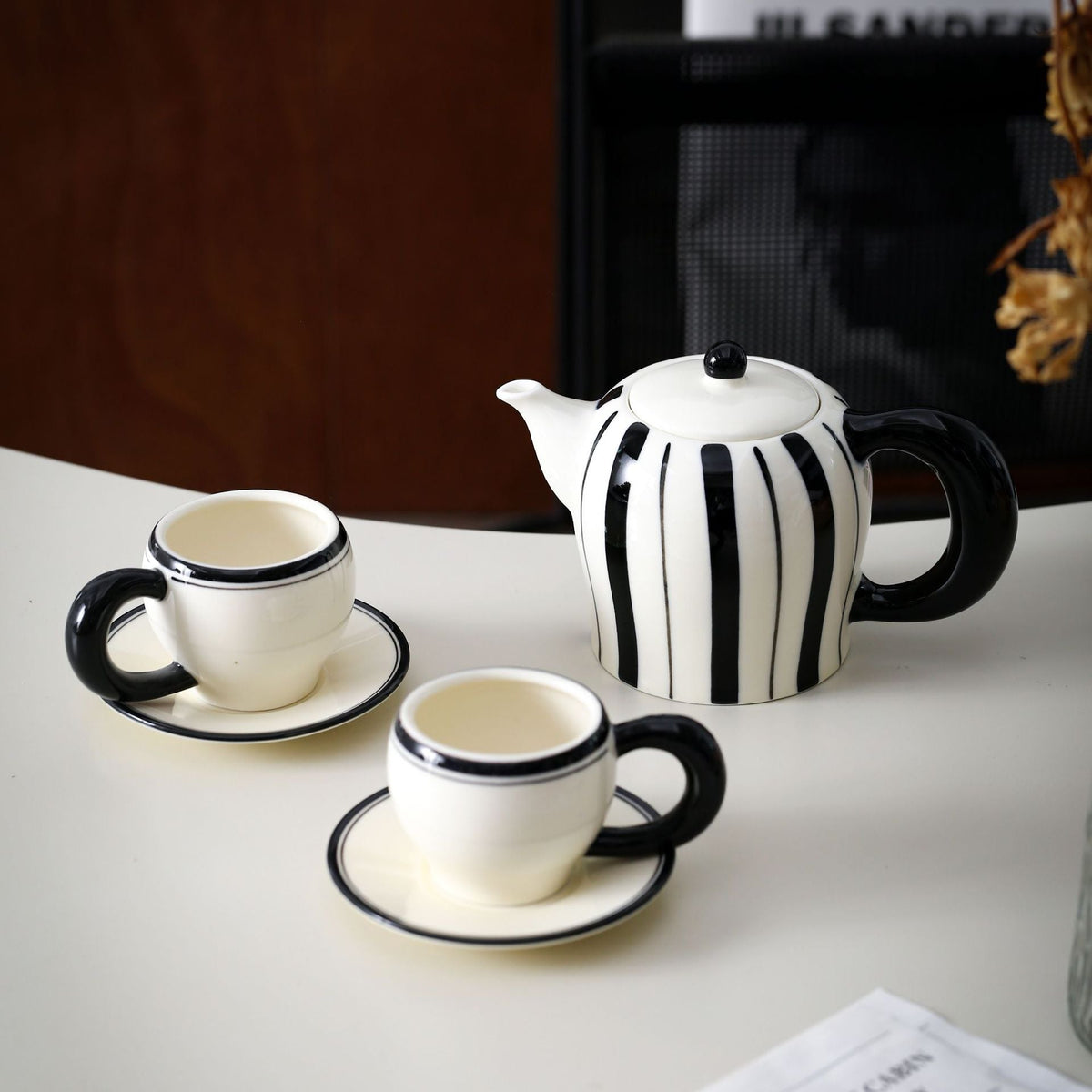 Porcelain tea set with vertical stripe decor and ergonomic handles — product view 1