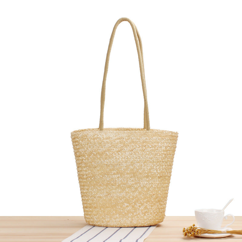 Shoulder bag made of braided natural material with long shoulder straps LoungeYard — product view 1