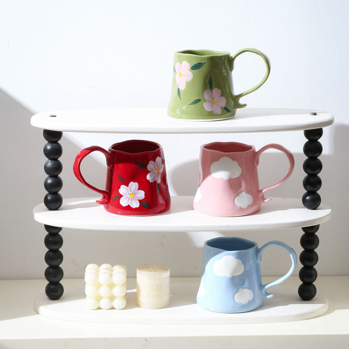 Hand-shaped ceramic mug with cloud relief and organic edge — product view 4