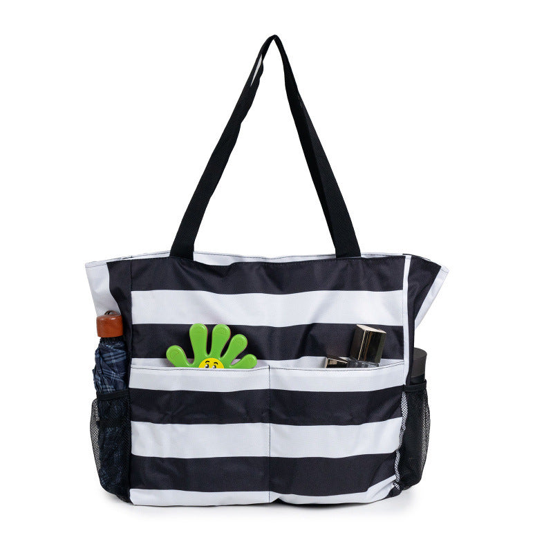 Spacious beach bag with practical outer pockets LoungeYard — product view 1
