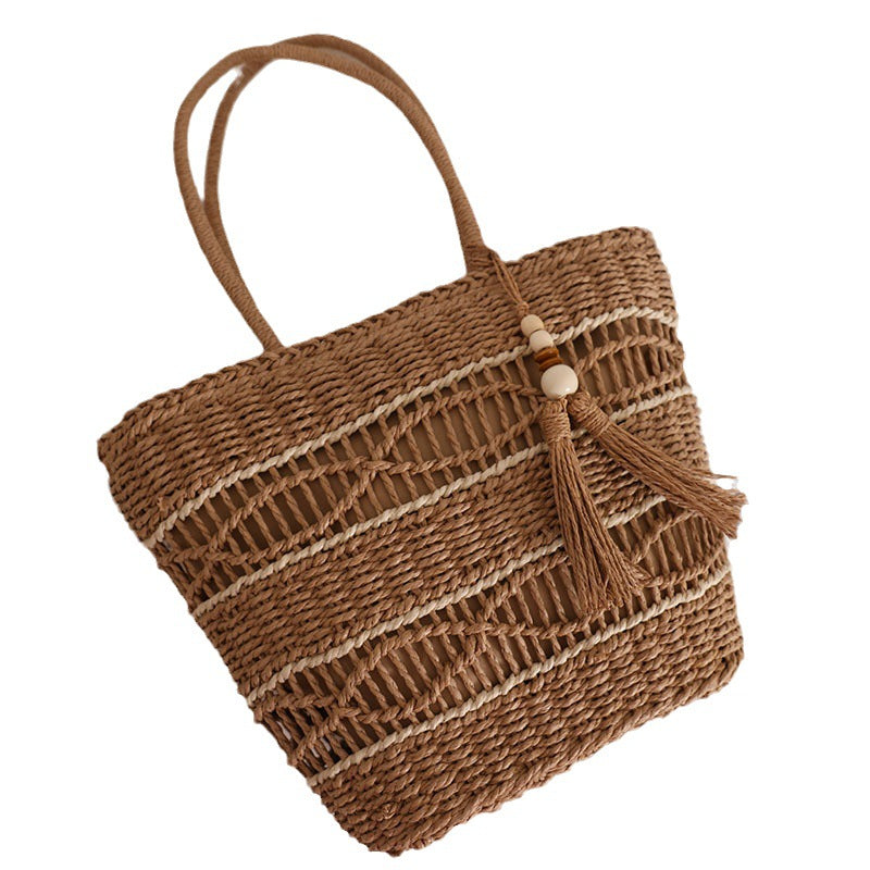 Handcrafted straw tote bag with decorative tassel detail LoungeYard — product view 5