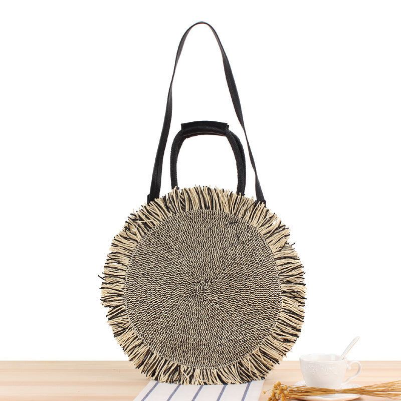 Round bag with fringe decoration Made of woven material LoungeYard — product view 5