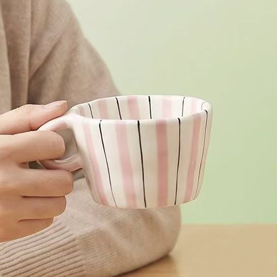 Ceramic coffee mug with ergonomic round handle and fine striped texture — product view 6