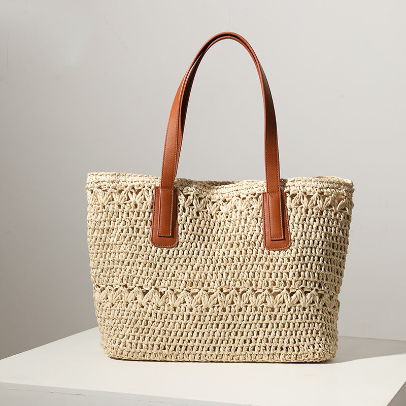 Braided straw bag with sturdy leather handles LoungeYard — product view 1