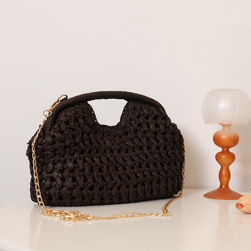 Handcrafted rattan bag with elegant handles and chain straps LoungeYard — product view 4