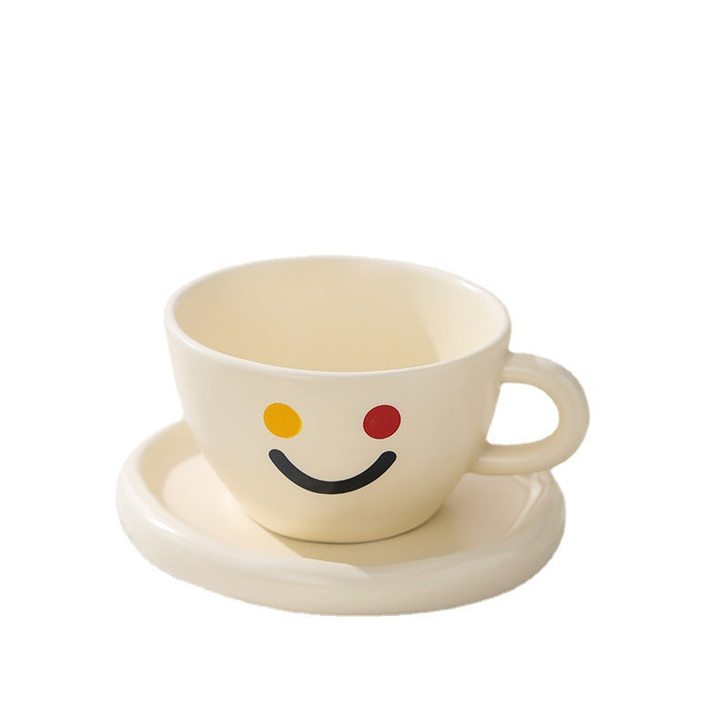 Handcrafted ceramic mug and plate set with cheerful smiley relief and organic shape — product view 5
