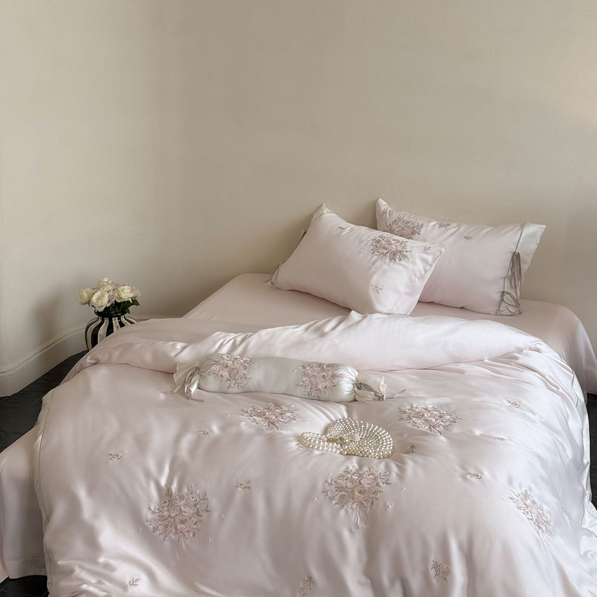 Fine glossy satin bedding set with embroidered rose bouquets and decorative pillow roll LoungeYard — product view 2