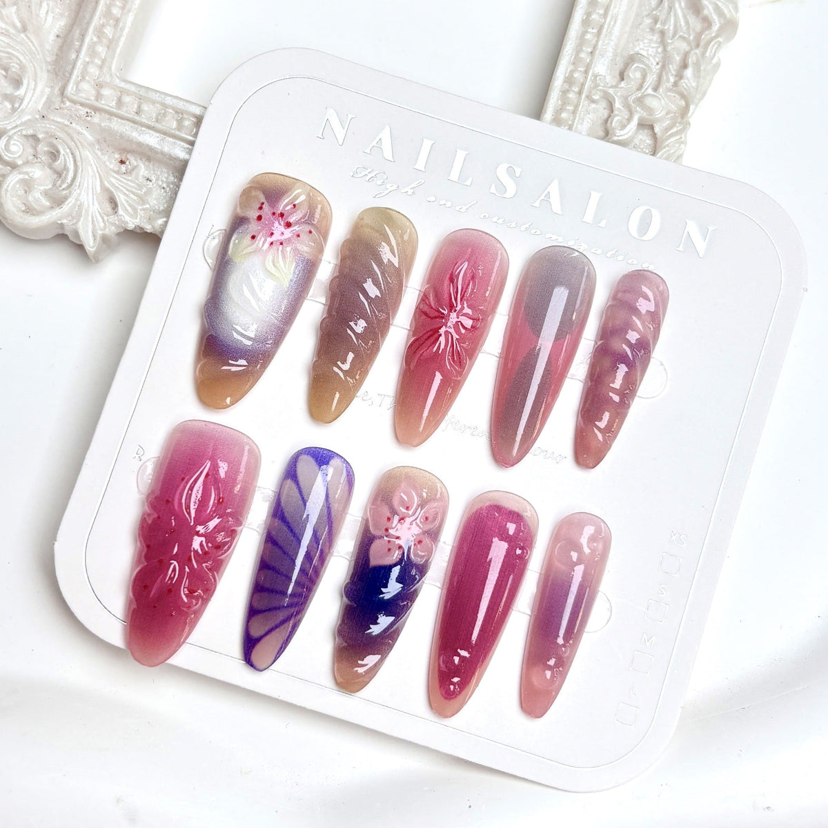 Decorative Press-On Nail Set with Floral and Artistic Designs — product view 5