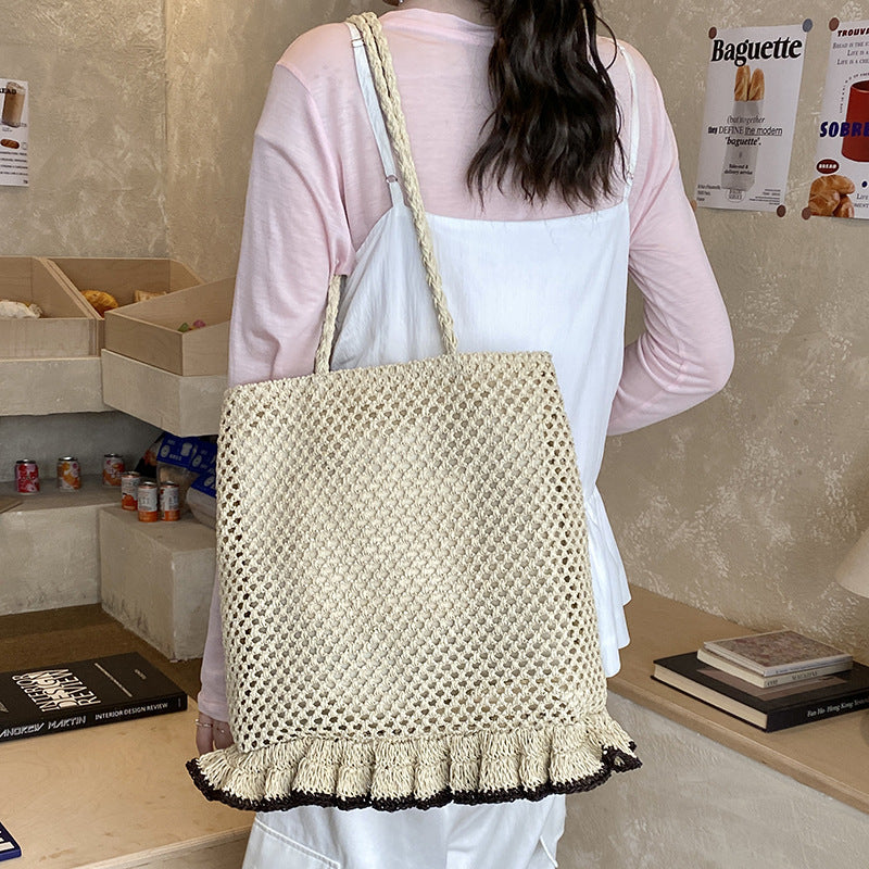 Handcrafted straw bag with fringed hem LoungeYard — product view 2