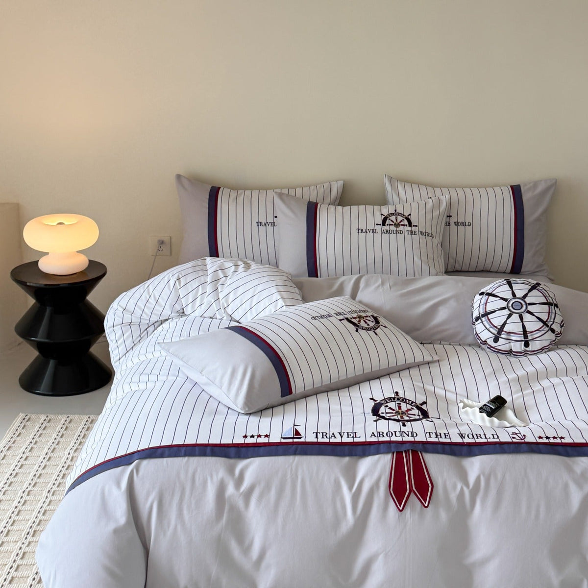 Maritime bedding set made of cotton satin with embroidered steering wheel and fine pinstripes — product view 3