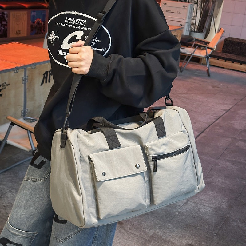 Versatile sports and travel bag with practical outer pockets LoungeYard — product view 1