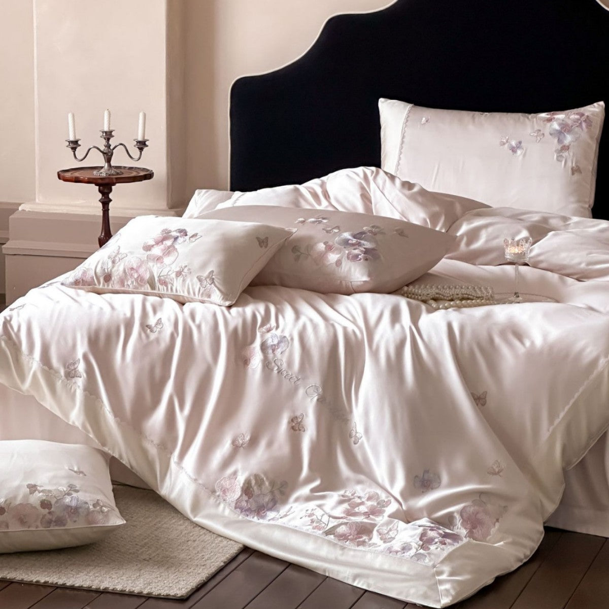 Luxurious satin bedding set with floral embroidery and butterfly appliqué — product view 1