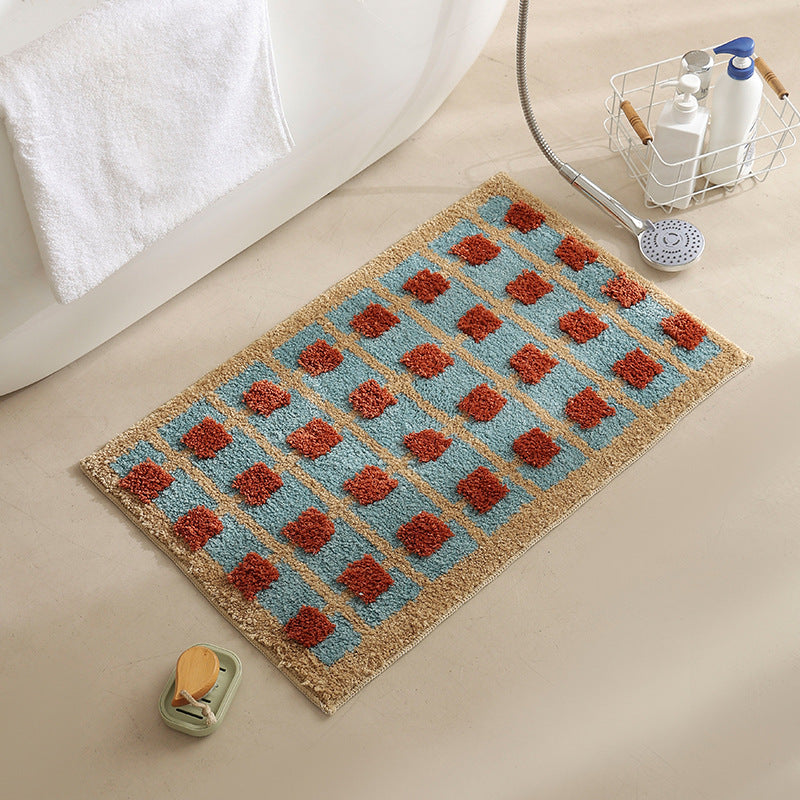 Hand-tufted bathroom bath mat with non-slip backing and textured square relief LoungeYard — product view 7